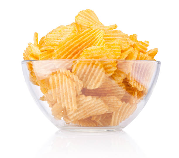 istock Crinkle cut potato chips in bowl isolated on a white background 1222405044