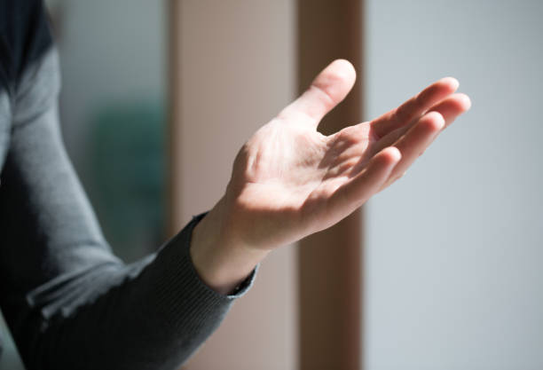 istock Man wipes her hands with alcohol-based hand-washing spray. Sars-CoV-2 and Covid-19 infection 1222407270