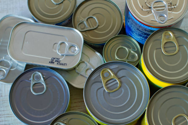 istock Canned food on the table background. 1222407557