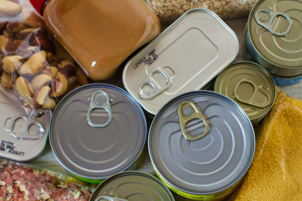 Canned food on the table background. stock photo