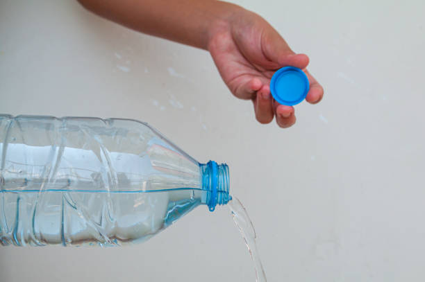 pouring water from water bottle