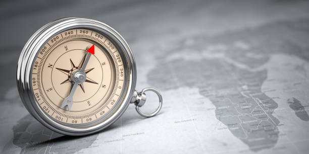 istock Compass on vintage old map.  Travel geography navigation and adventure concept background. 1222408508
