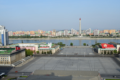 Pyongyang, North Korea - April 29, 2019: View on the city, monument to the Juche idea - Juche Tower, Taedong River and the central square of Kim Il Sung