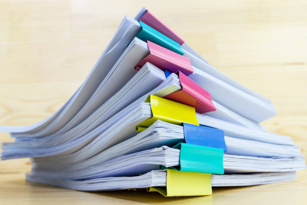 istock pile of papers at work office for business on the table, concept document in work office 1222412468