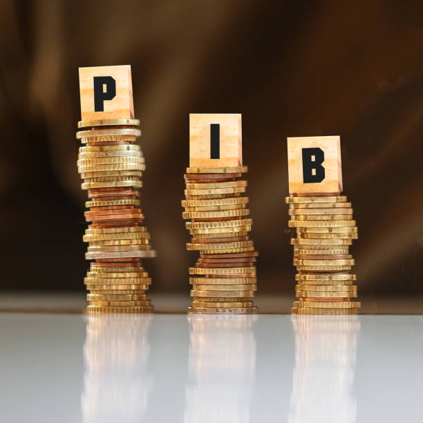 Gross Domestic Product decreasing Three money stacks with a decreasing trend, and with the letters PIB (Producto Interior Bruto in Spanish, or Produit Interieur Brut in French) on them gdp stock pictures, royalty-free photos & images