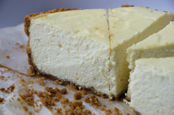 istock Fragrant homemade cheesecake with chocolate base, cut into pieces, lying on a light background 1222417256