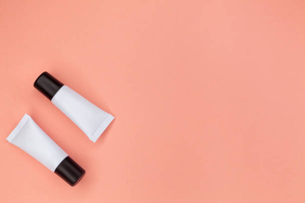 istock Tubes with cosmetics on a pink background. 1222418364