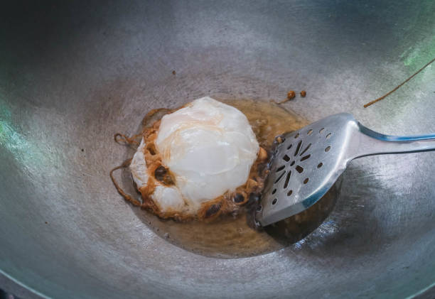 Fry fried eggs in a pan stock photo