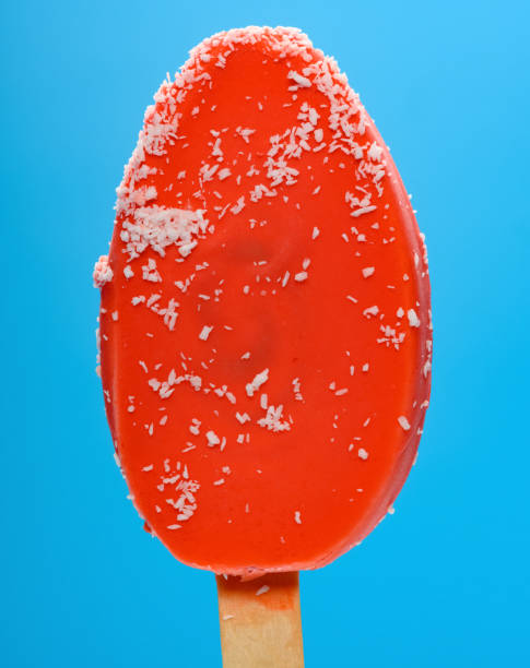 istock fresh red popsicle with shredded coconut on a blue background 1222422207
