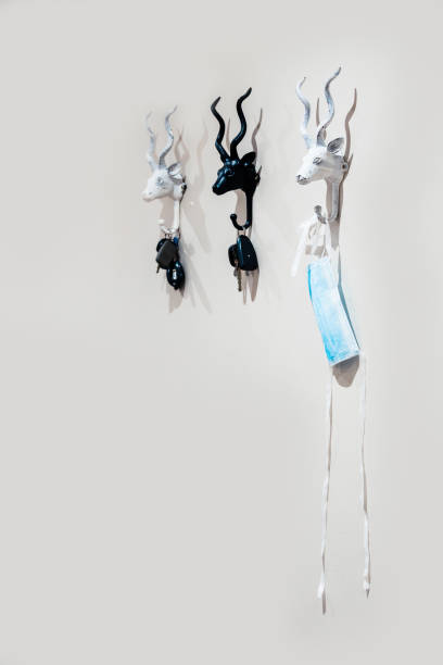 istock carkeys and mask hanging on hooks the new normal 1222424372