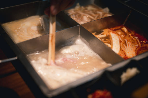 istock Shabu hot pot with four different types of soup. Close up 1222427563