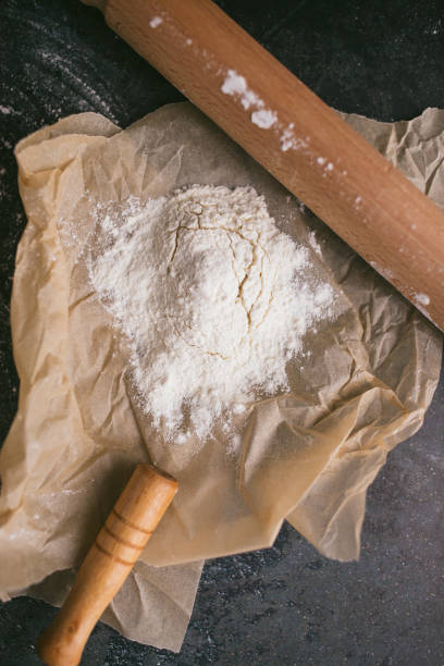 istock Bread on a dark with flour cooking pan 1222427760