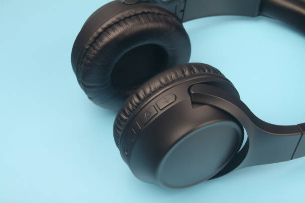 istock Professional wireless headphones isolated on blue background 1222427791
