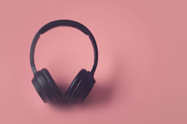 istock Professional wireless headphones isolated on pink background 1222427821