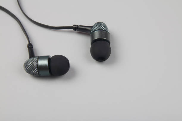 istock Earphones lying on the blue background 1222429158