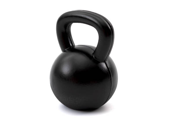 istock Train with heavy weights, weightlifting exercising and build muscle through resistance training concept with a single black kettlebell isolated on white background with clipping path cutout 1222430420