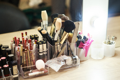Minsk, Belarus - February 11 2020: Set of different cosmetics on the table in front of the mirror