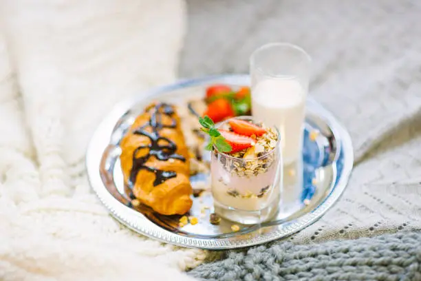Healthy breakfast with crunchy flakes, milk and strawberry
