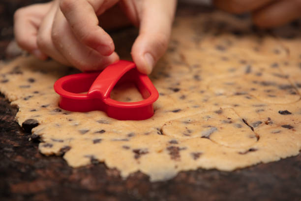 istock Close-up child`s hands preparing cookies 1222434433