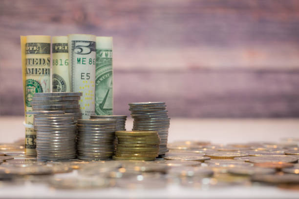 istock Stacks of coins on the white table, Money saving concept with copy specs 1222435255