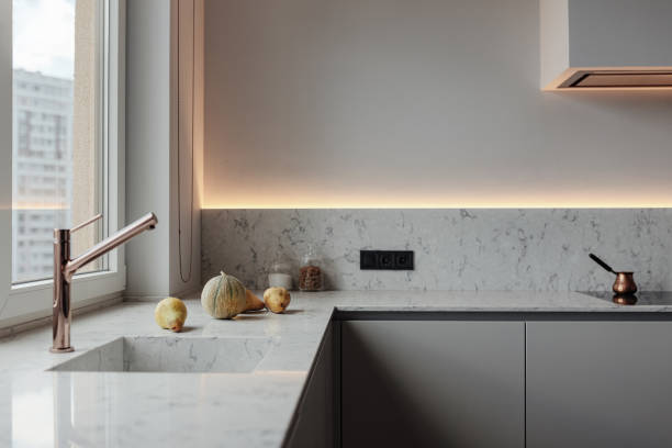 istock Light kitchen modern style, White walls, marble working surface and wash. Copper crane 1222435373