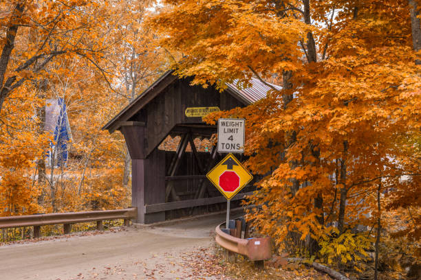 Stowe, Vermont, USA at Emily's Bridge with fall colors.