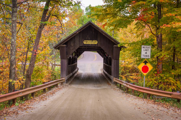 Stowe, Vermont, USA at Emily's Bridge with fall colors.