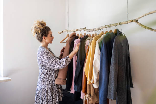 istock Young woman choosing clothes 1222438448