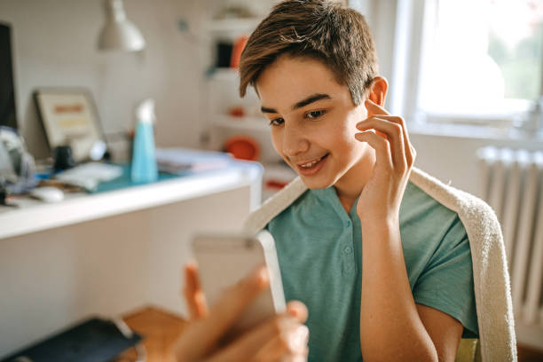 istock Boy taking selfie after haircut 1222439189