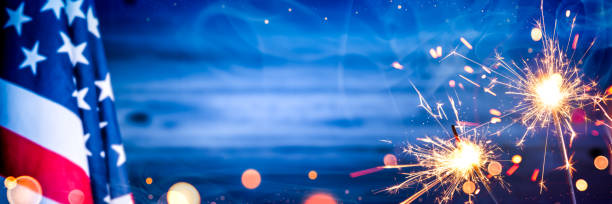 Flag With Sparklers And Smoke On Wooden Background