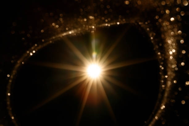 Easy to add lens flare effects for overlay designs or screen blending mode to make high-quality images. Abstract sun burst, digital flare, iridescent glare over black background.