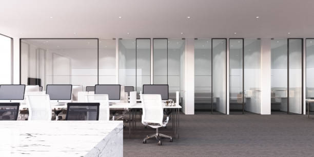 istock Modern office working area with grey carpet floor and white desk and meeting room 3d rendering 1222444753