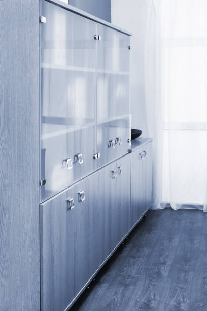 istock bookcase with glass doors in the office 1222448725