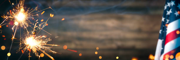 istock Vintage American Flag With Sparklers And Smoke 1222449590