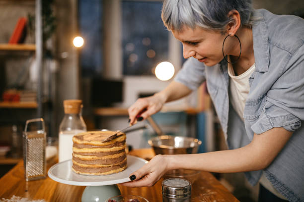 istock Woman making cake at domestic kitchen 1222450889