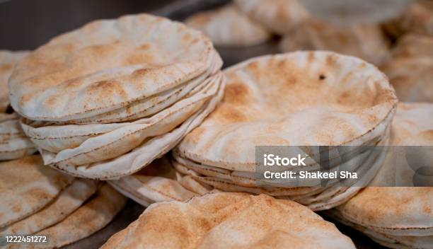 Kuboos Or Khubz Fresh Pita Bread Togeather In A Table Stock Photo - Download Image Now