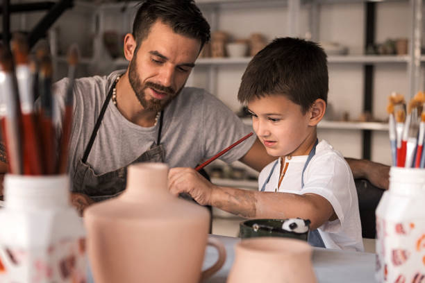 istock Artistic family painting pottery 1222451971