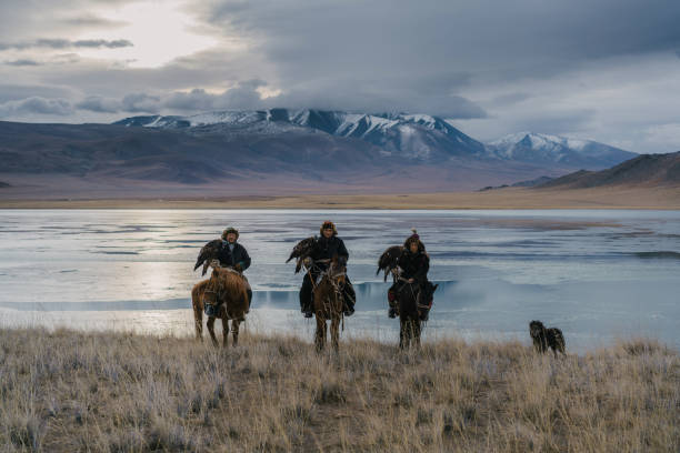 istock Eagle hunters on horses near the river in Mongolia 1222453030