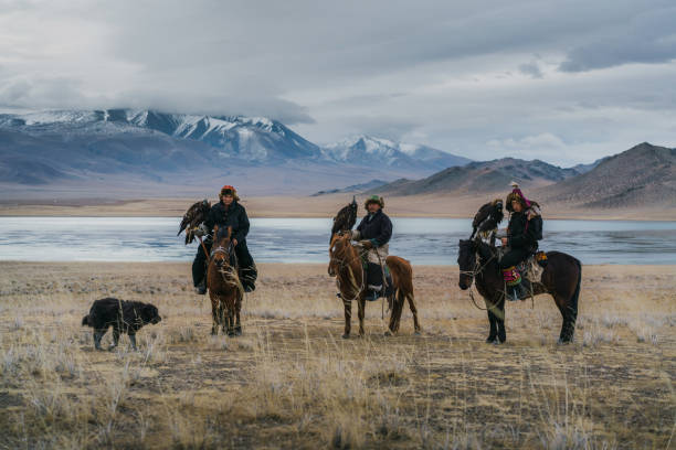 istock Eagle hunters on horses near the river in Mongolia 1222453036