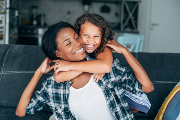 istock Affectionate mother and daughter embracing at home. 1222453877