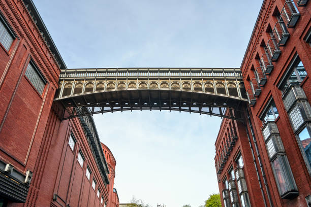 istock metal footbridge and Red brick wall in an old brewery 1222454337