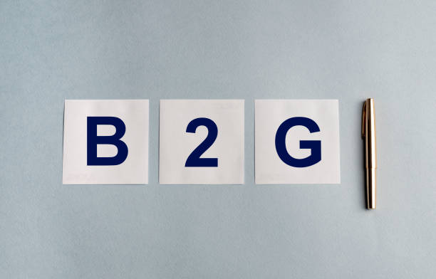istock B2G text inscription on white papers with pen on blue table Representing Business 2 Government Business Model 1222455201