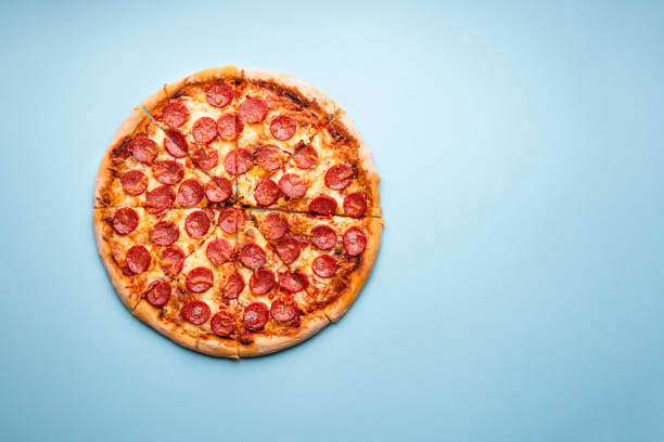 istock Sliced pizza flat lay. Hot pepperoni pizza 1222455563