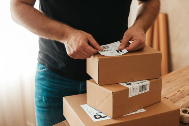 istock Man preparing a shipment as ordered stock photo 1222457443
