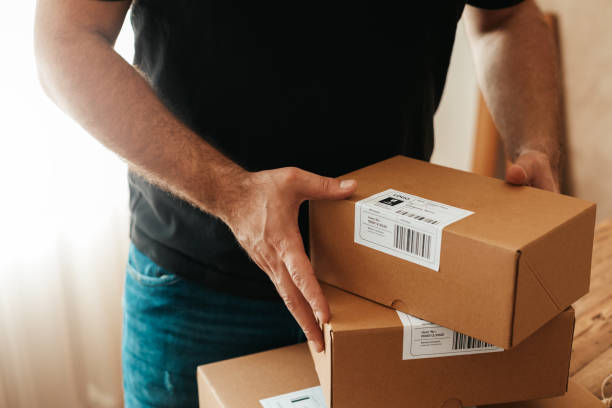 istock Man preparing a shipment as ordered stock photo 1222457450