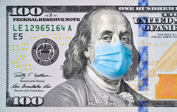 istock One hundred dollar bill with medical face mask on Benjamin Franklin. 1222457840