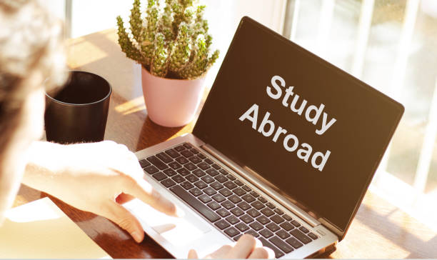 istock STUDY Student Studying Hard and Students Studying Learning Education Thoughtful male person looking to the digital tablet screen, laptop screen,Silhouette and filter sun 1222458946