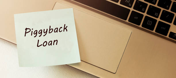 istock Closed up finger on keyboard with word PIGGYBACK LOAN 1222458958