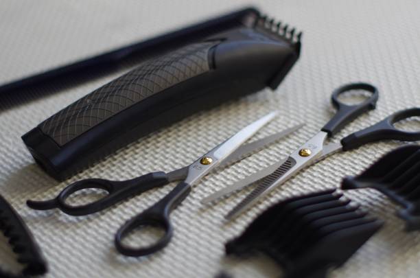 istock Working tools of barber master. Hair salon table with bokeh effect. 1222461041