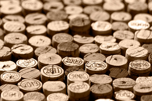Used natural wine corks random selection, some of them marked with years of vintage, monochrome brown